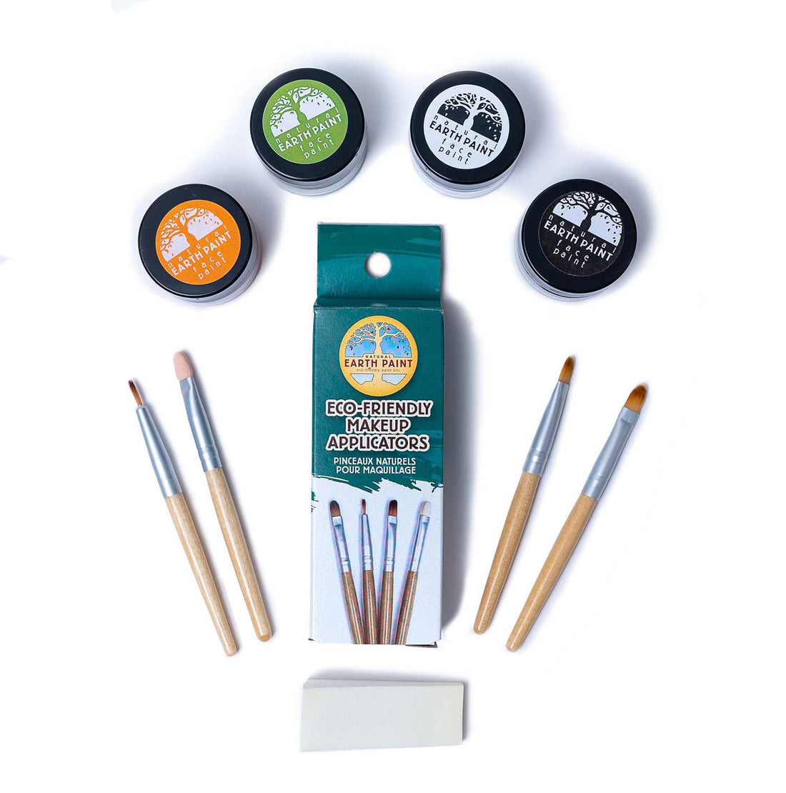 Components of the Halloween Natural Face Paint Set including four jars of face paint, four makeup applicators and a makeup sponge