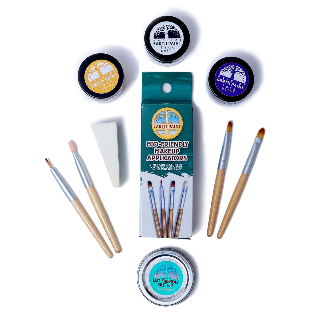 Components of the Unicorn Natural Face Paint Set including three face paint colors, turquoise glitter, four makeup applicators and a makeup sponge