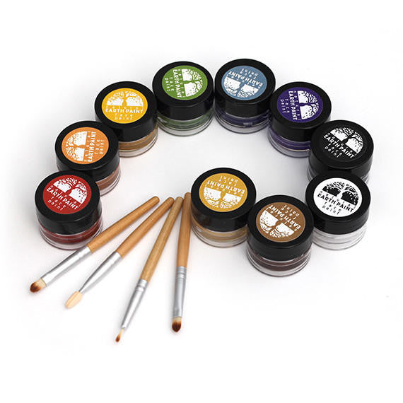 Jars of all ten colors of face paint arranged artistically with four applicator brushes