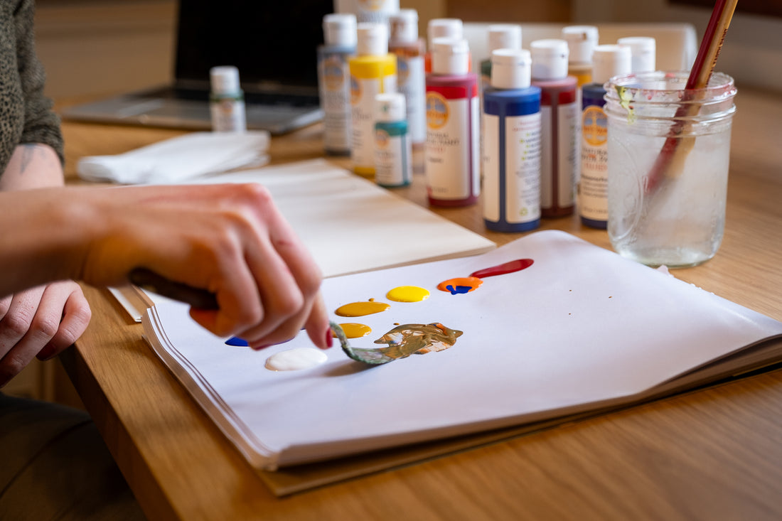 hand mixing fluid acrylic paint colors