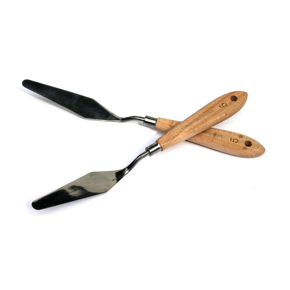 two Palette Knives crossed on a white background