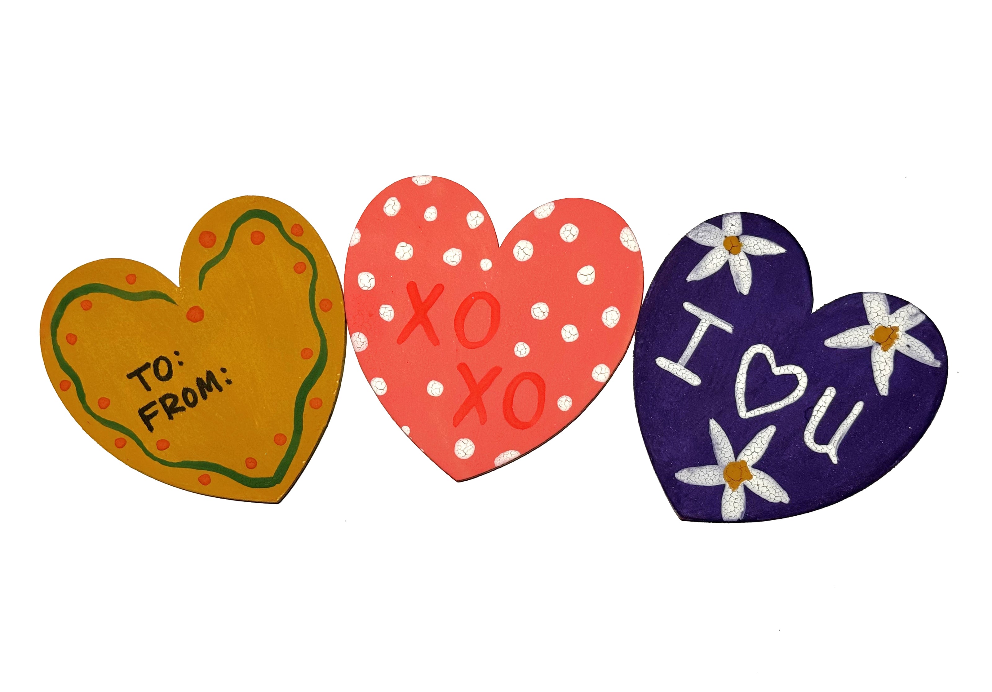 3 hearts painted with messages of love