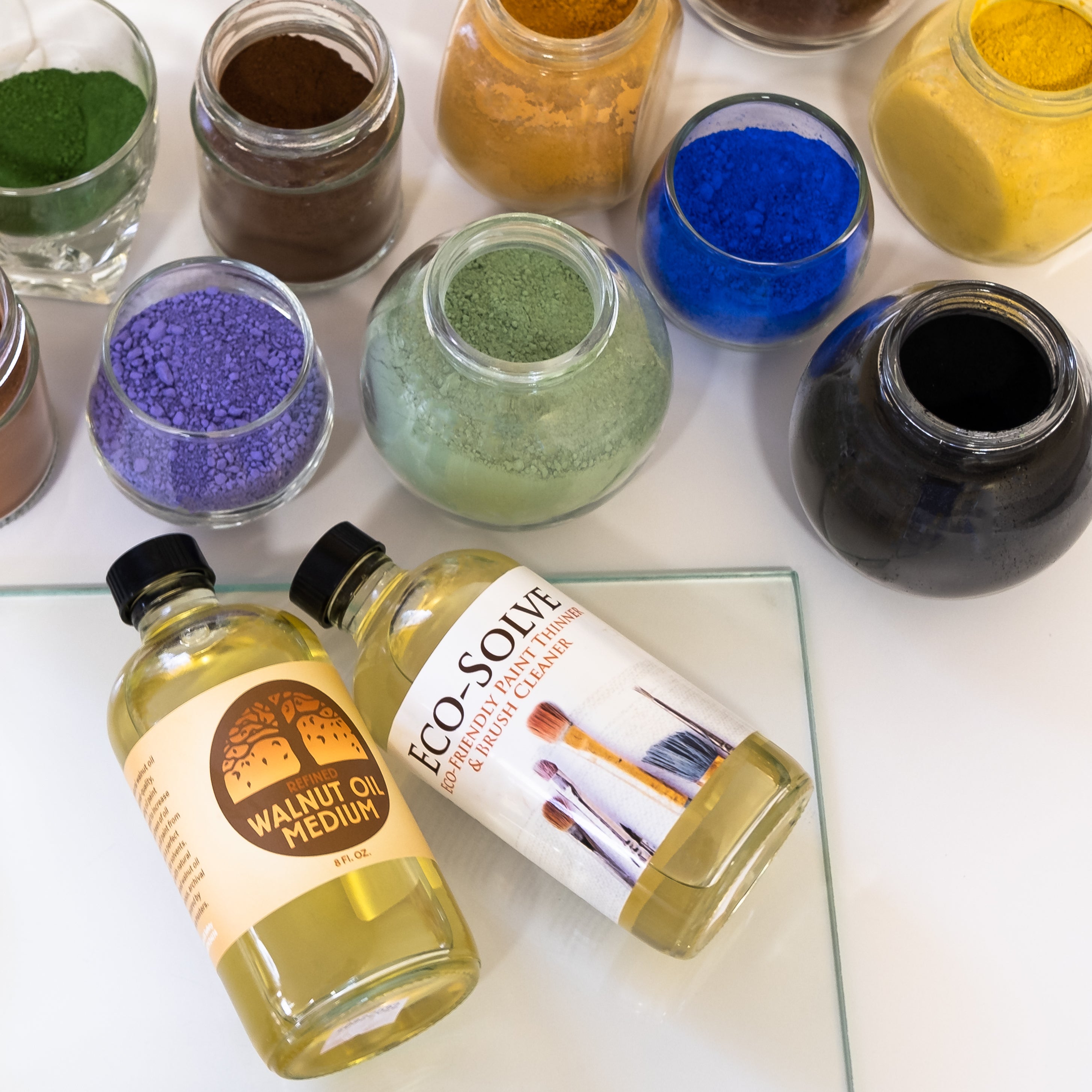 jars of walnut oil eco-solve and pigments for oil painting