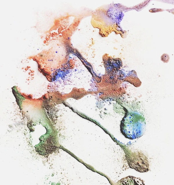 Colorful and textured splatter painting made using baking soda & vinegar