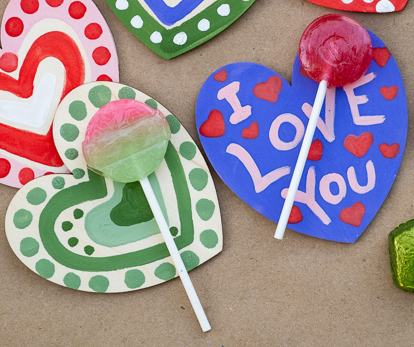 2 painted hearts with lollipops