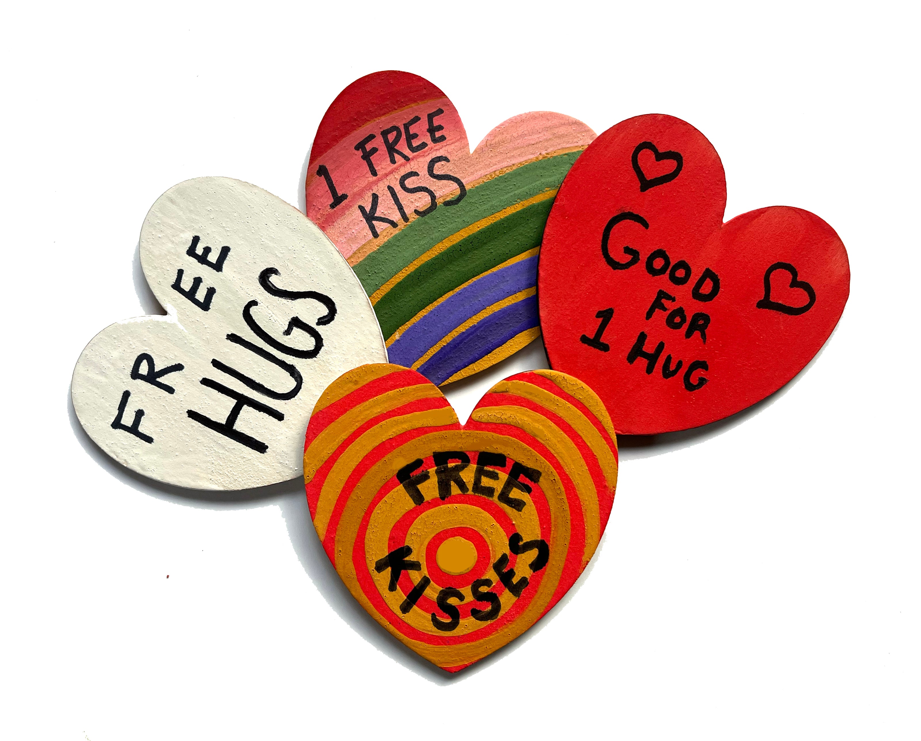 Painted wooden hearts with token offerings