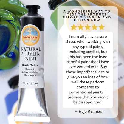 Tube of black acrylic paint next to a 5 star review of the product