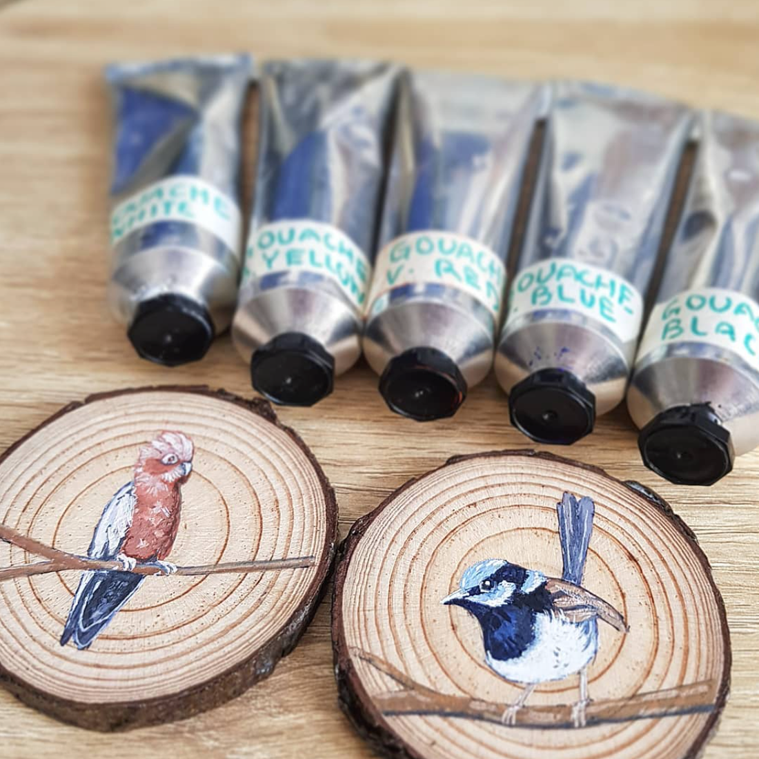 birds painted on wood pieces with guoache