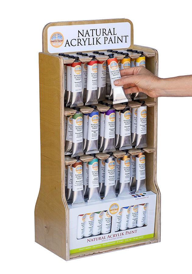 A wooden Natural Acrylik Paint display case featuring tubes of all fifteen colors and the Natural Acrylik Earth Pigment Set