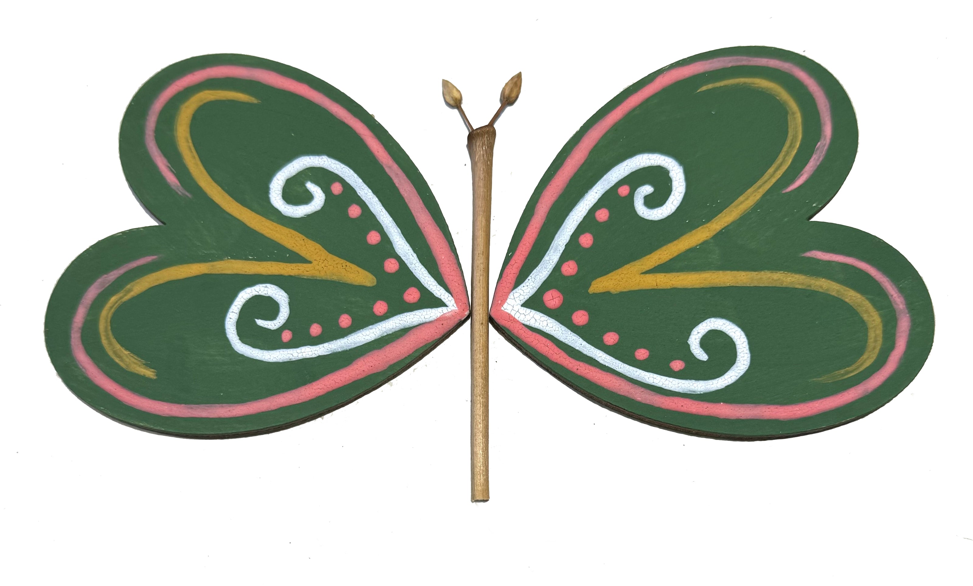 a butterfly constructed from two painted wooden heart pieces and some natural elements like a twig and seed pods