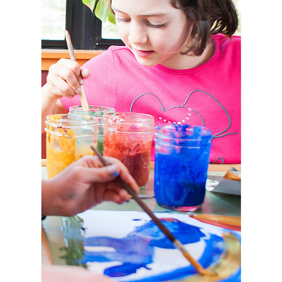 Two children painting with Natural Earth Paint